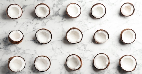 Photo of Coconut pattern on marble background, flat lay