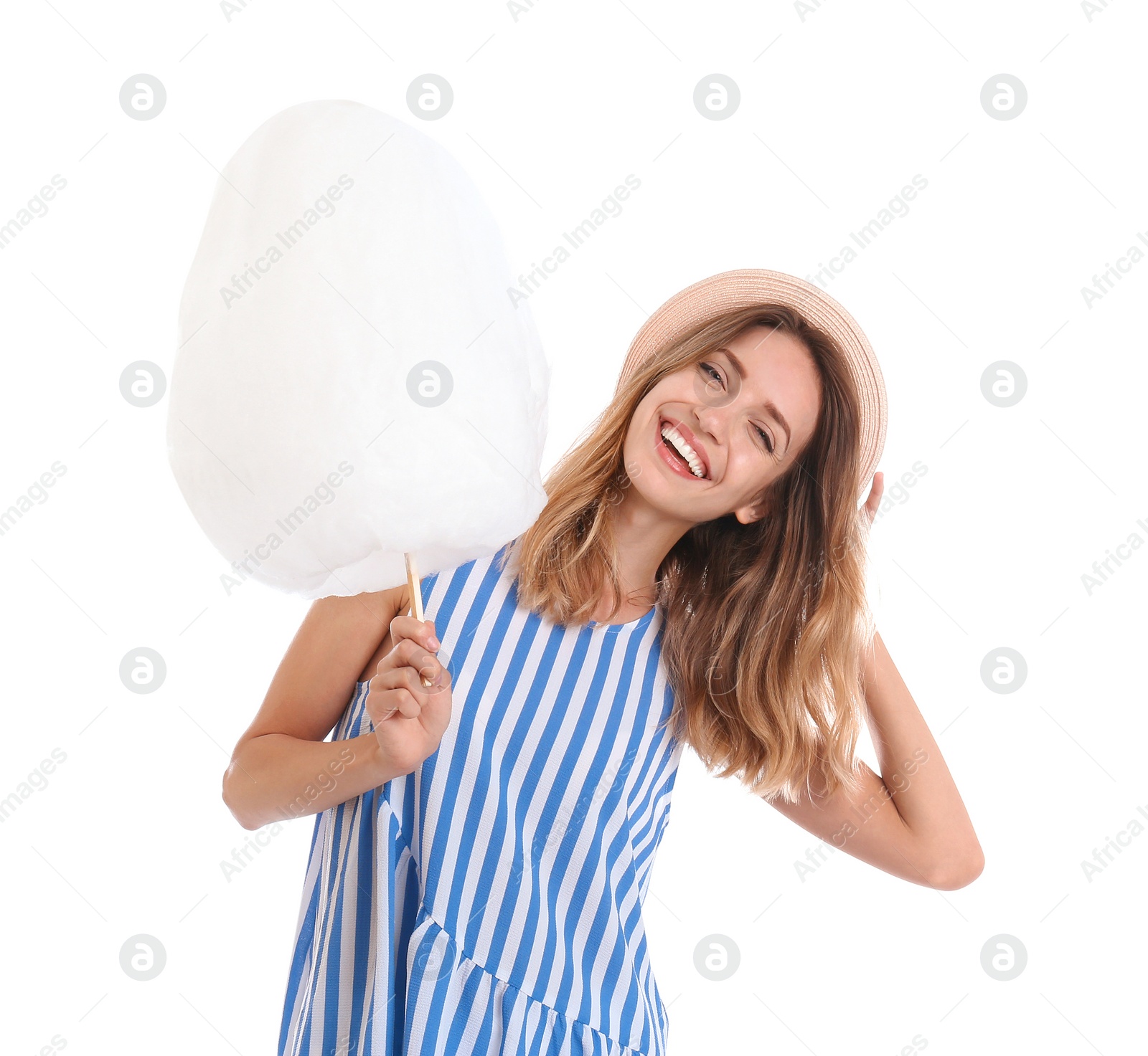 Photo of Happy young woman with cotton candy on white background