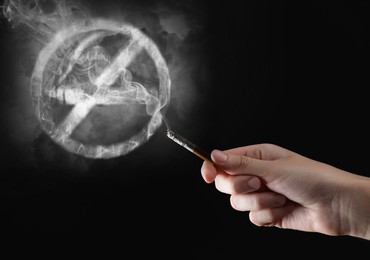 Image of No Smoking sign of smoke near woman with cigarette on black background, closeup