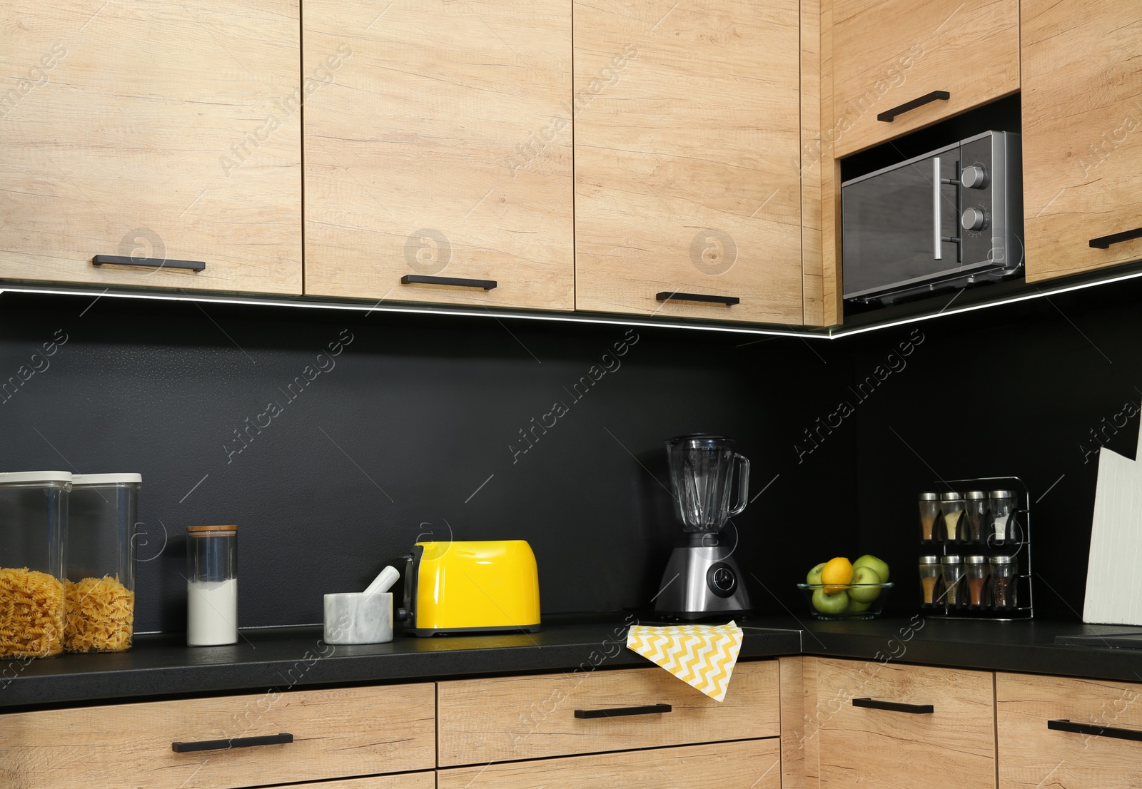 Photo of Kitchen interior with new furniture, appliances and houseware