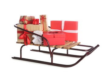 Photo of Sleigh with Christmas gifts on white background