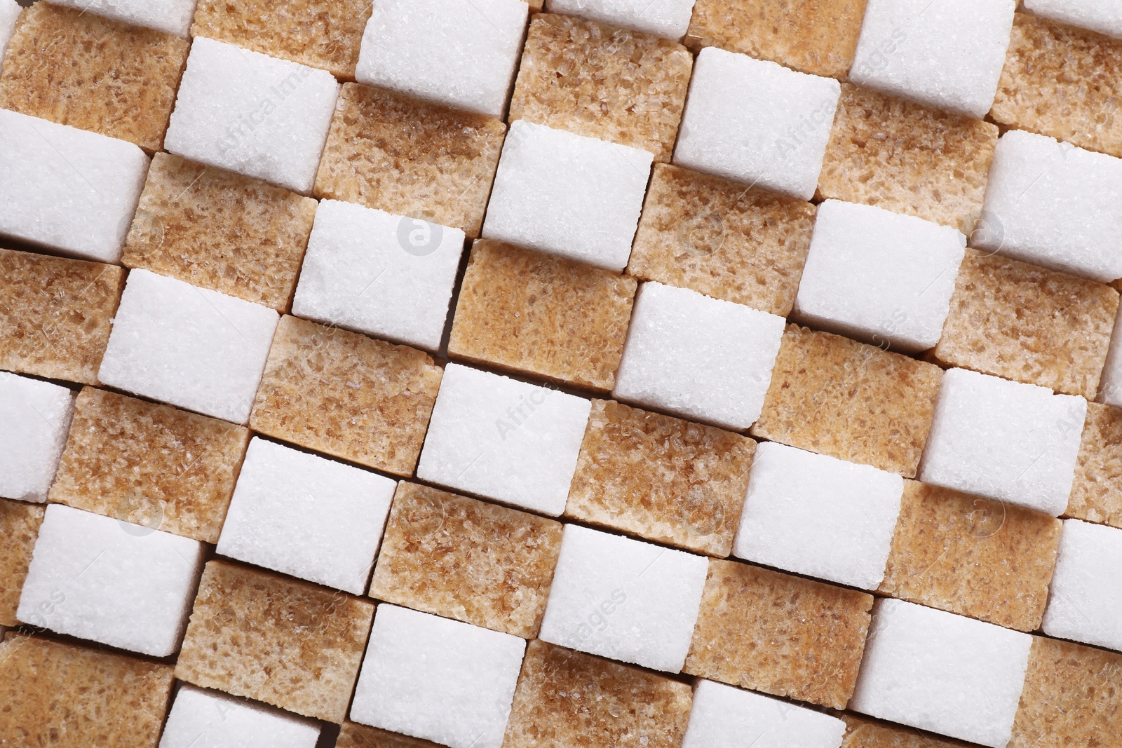 Photo of White and brown sugar cubes as background, top view