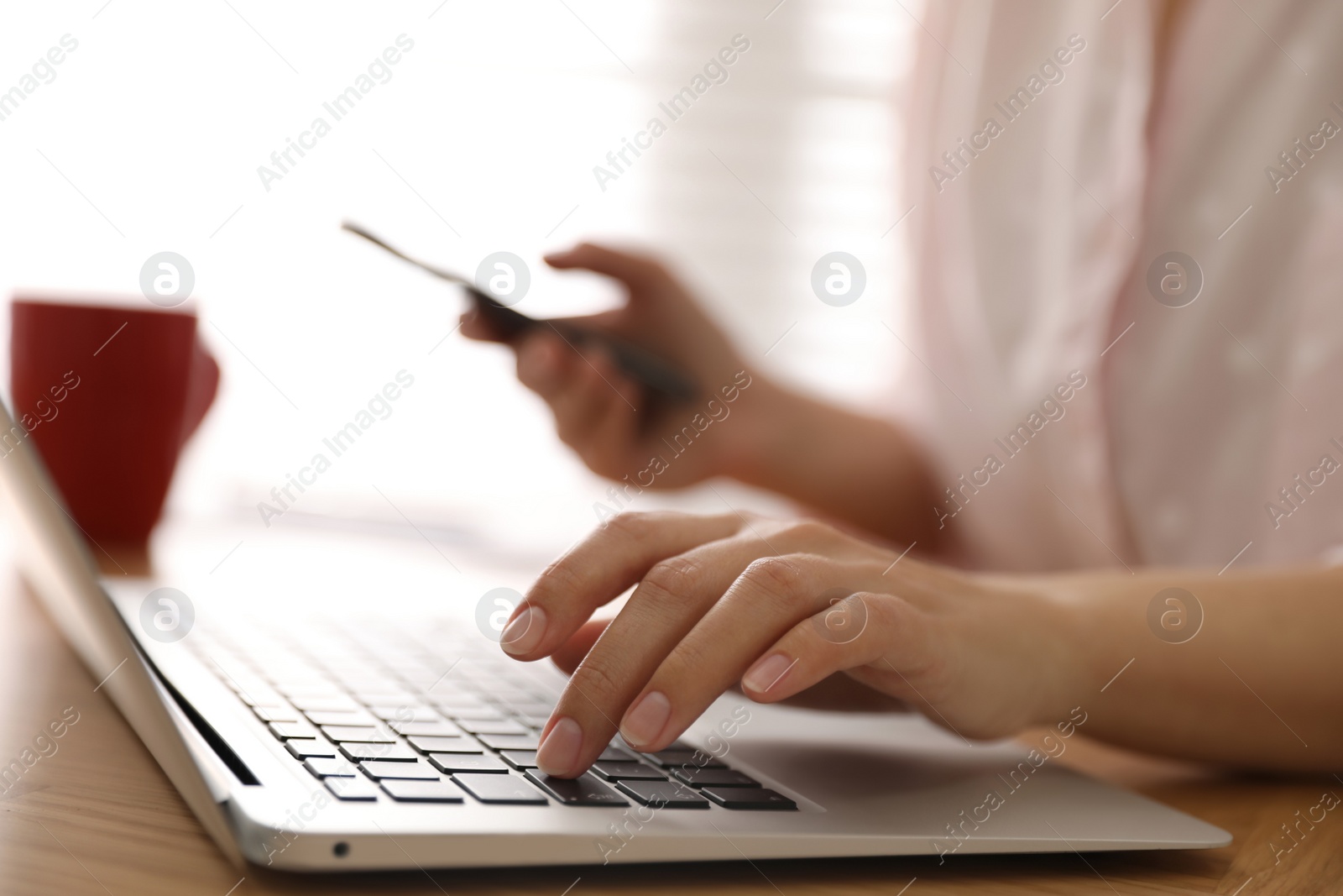 Photo of Woman working with laptop in office, closeup