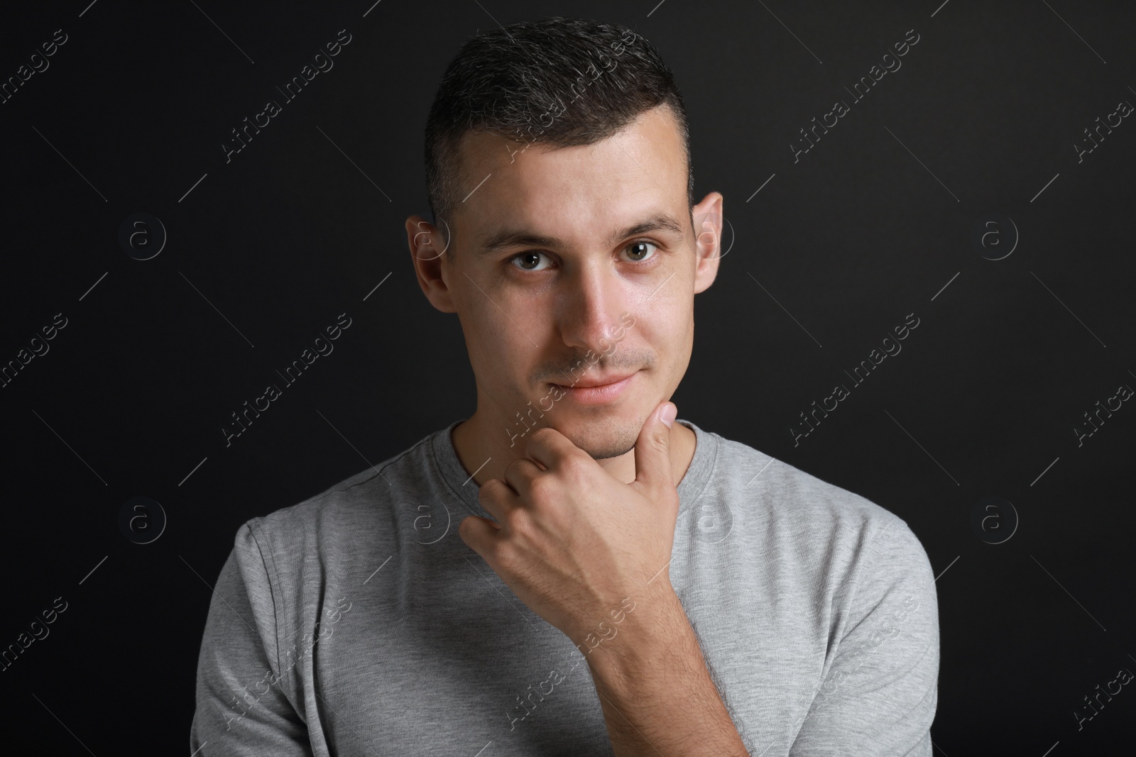 Photo of Portrait of handsome man on black background