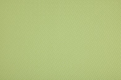 Stylish green wallpaper as background, closeup view