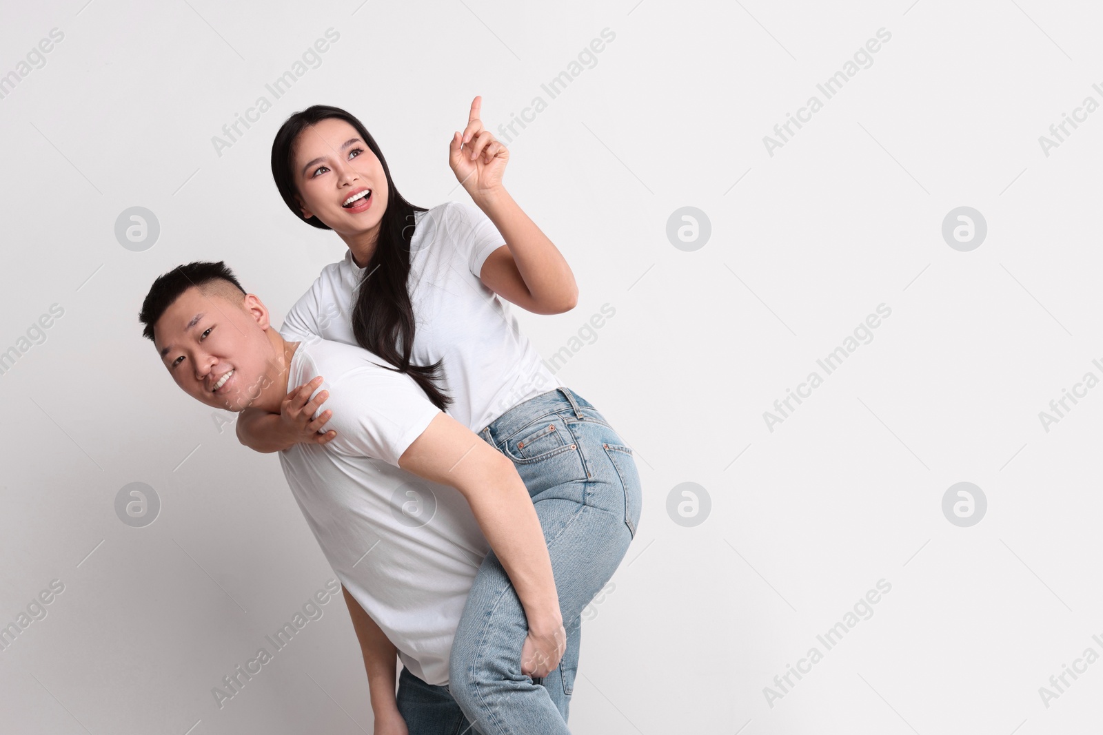 Photo of Portrait of happy couple on white background, space for text