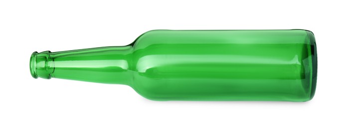 Photo of One empty green beer bottle isolated on white