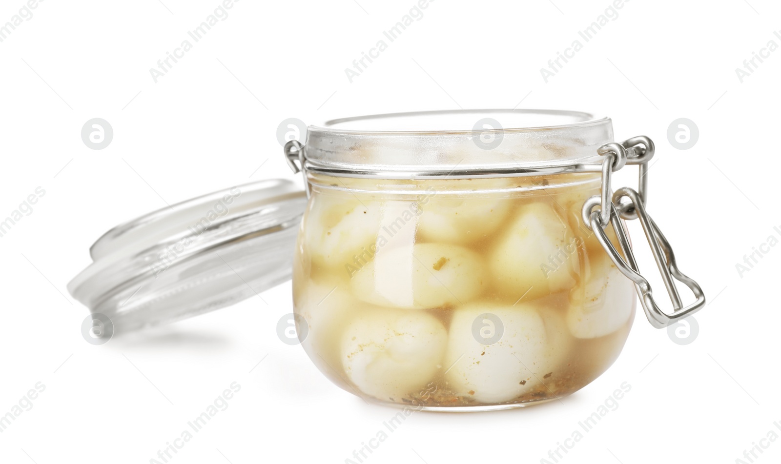 Photo of Glass jar with preserved garlic on white background