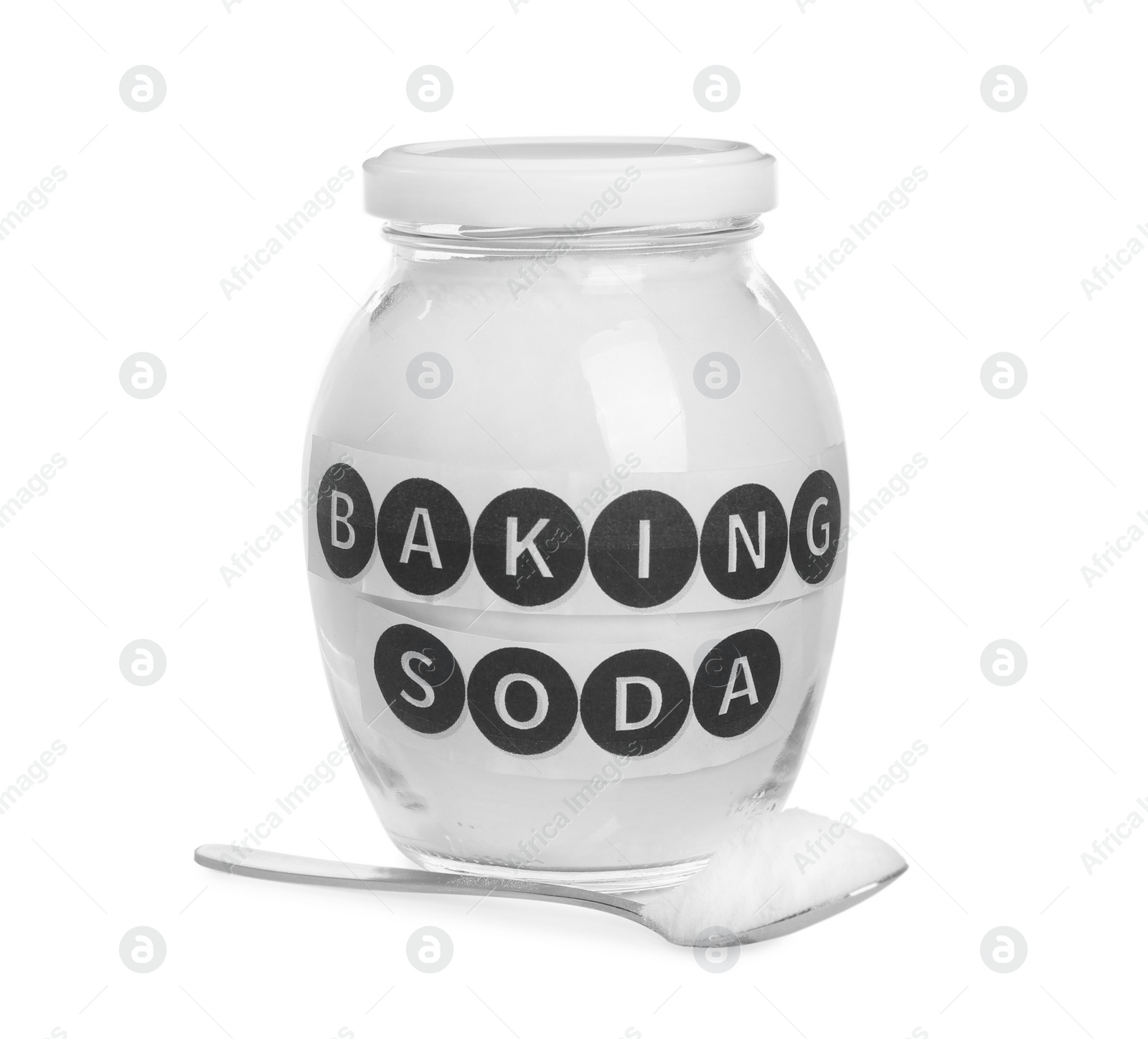 Photo of Spoon and jar with baking soda on white background