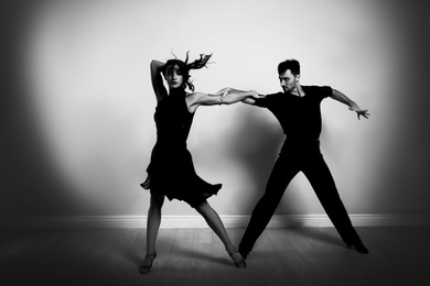 Image of Passionate young couple dancing in modern studio
