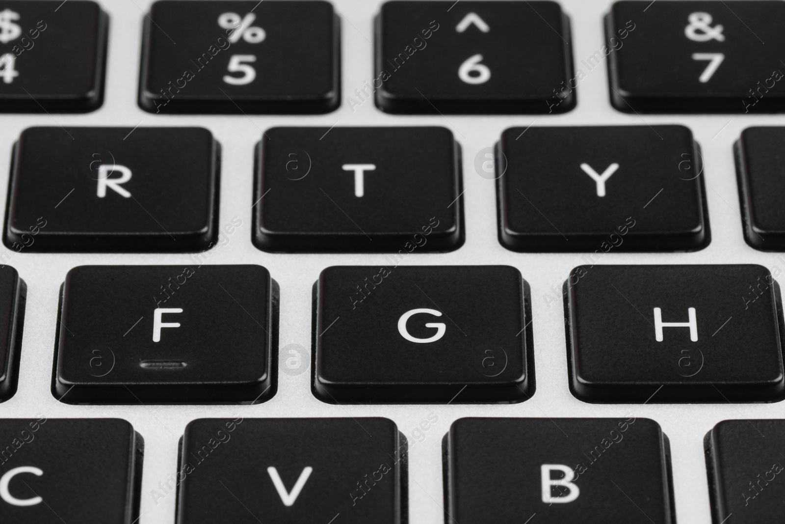 Photo of Closeup view of buttons on modern computer keyboard