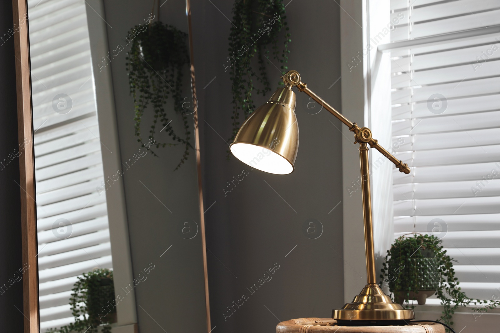 Photo of Room interior with stylish lamp and mirror