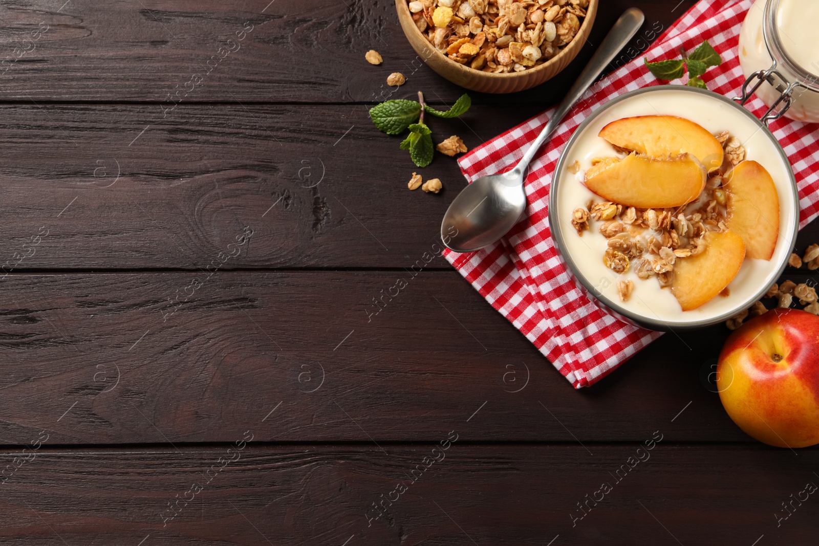 Photo of Flat lay composition with tasty peach yogurt on wooden table. Space for text