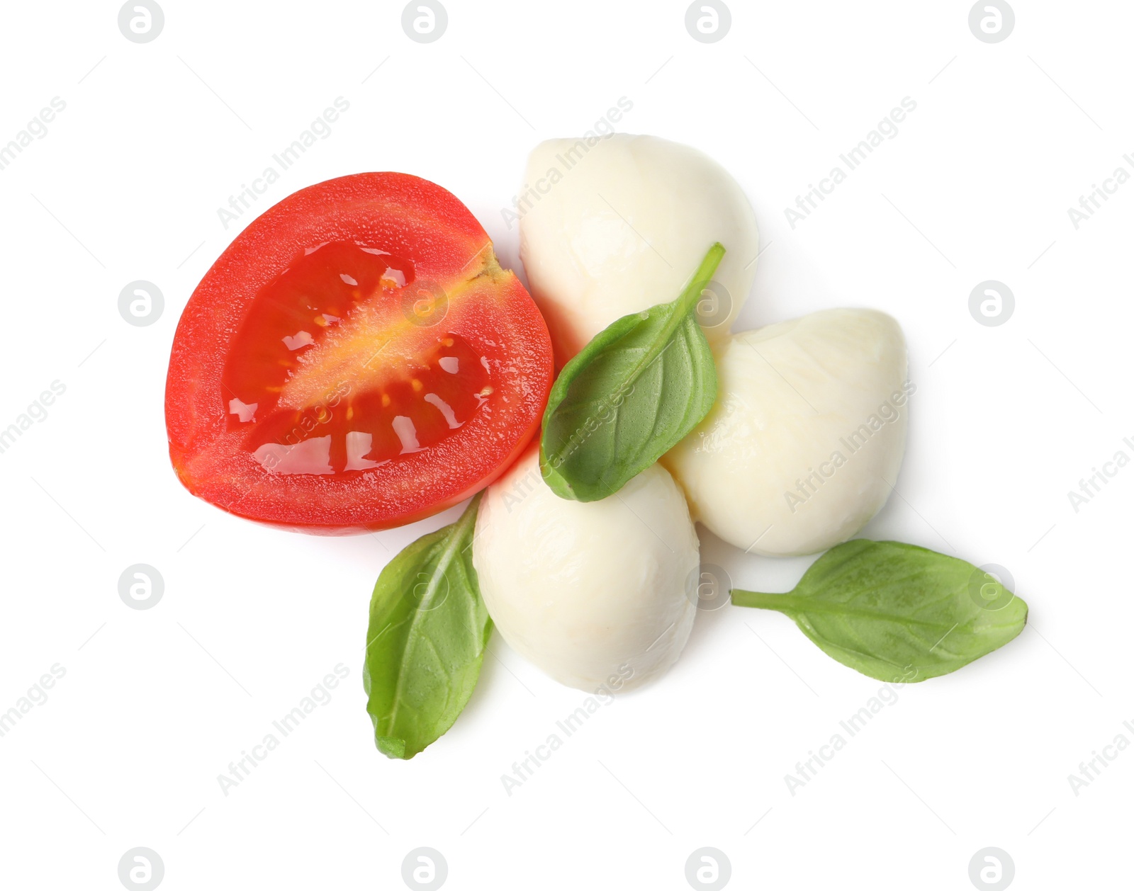 Photo of Delicious mozzarella, tomato and basil leaves on white background, top view