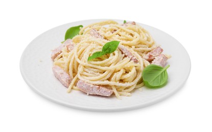 Photo of Plate of tasty pasta Carbonara with basil leaves isolated on white