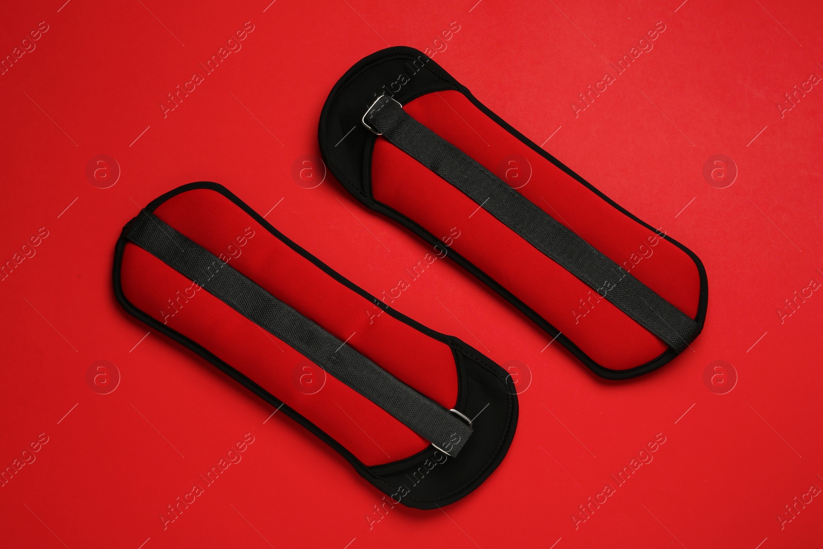 Photo of Weighting agents on red background, flat lay