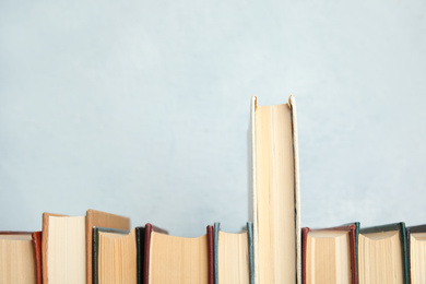 Photo of Collection of old books on light background