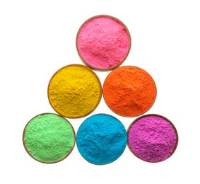 Photo of Colorful powders in bowls on white background, top view. Holi festival celebration