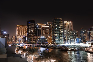 Photo of DUBAI, UNITED ARAB EMIRATES - NOVEMBER 03, 2018: Night cityscape of marina district with illuminated buildings