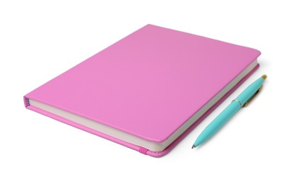 Photo of Closed pink office notebook and pen on white background