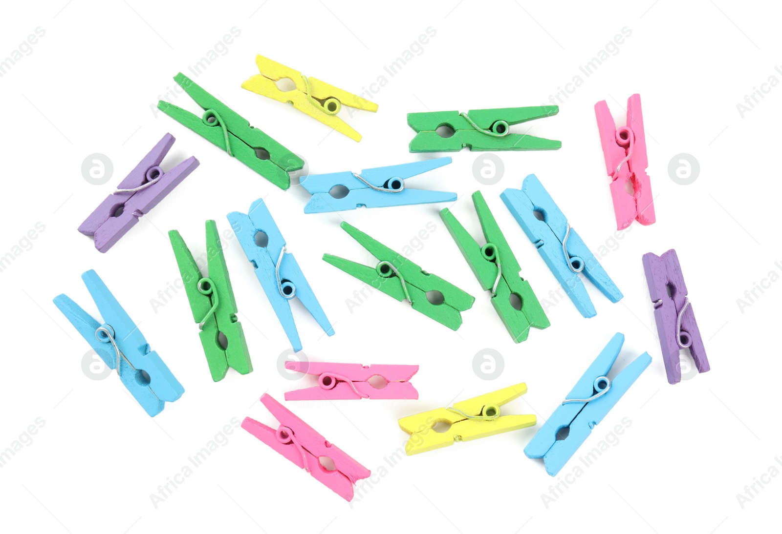 Photo of Many colorful wooden clothespins on white background, top view