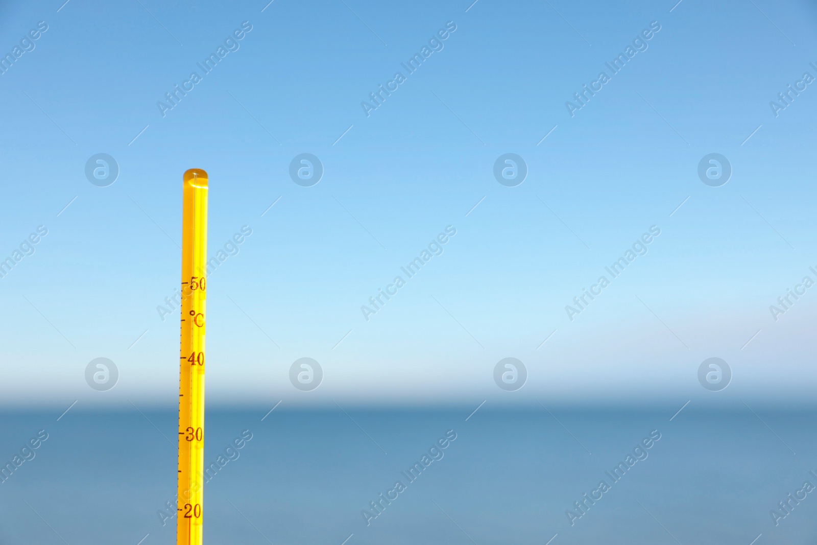 Photo of Weather thermometer at seaside, space for text