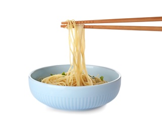 Bowl of cooked Asian noodles and chopsticks isolated on white