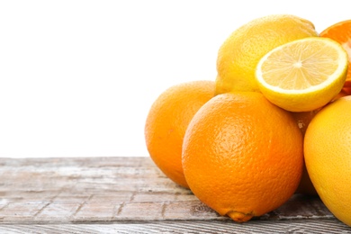 Set of fresh citrus fruits on wooden table