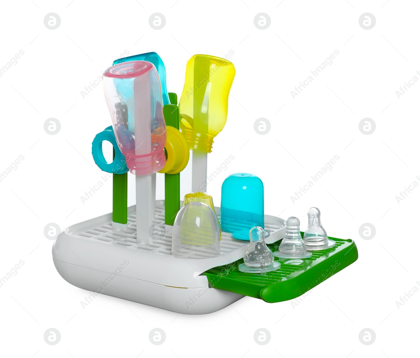 Photo of Dryer with baby bottles and nipples after sterilization on light grey table against white background