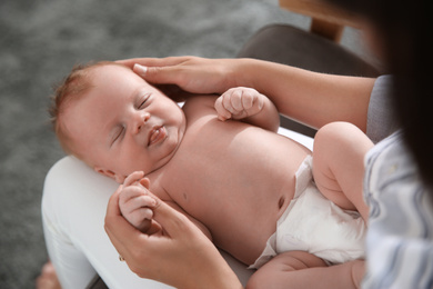 Mother with her newborn baby, closeup view