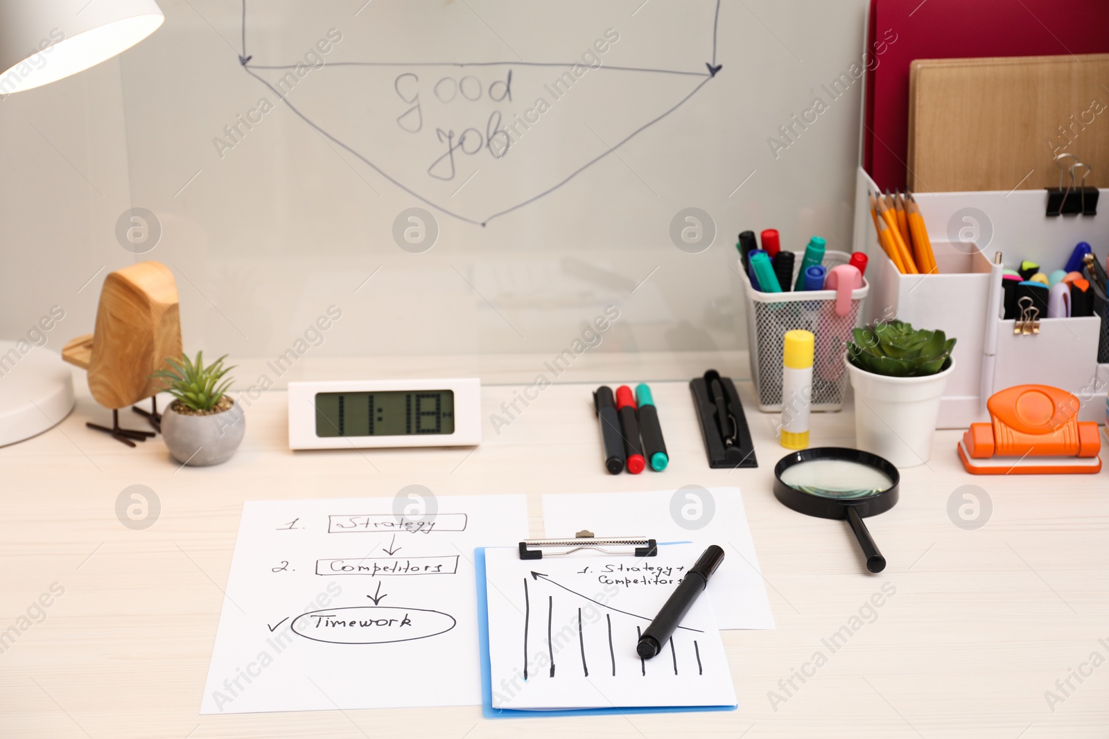 Photo of Business process planning and optimization. Workplace with plan, notebook and stationery on white wooden table