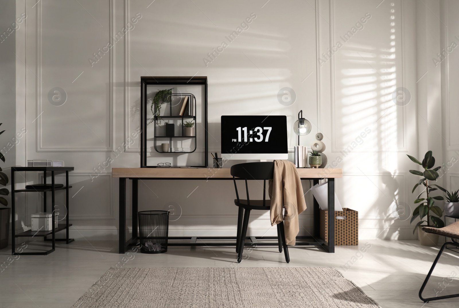 Photo of Room interior with comfortable workplace. Modern computer on wooden desk