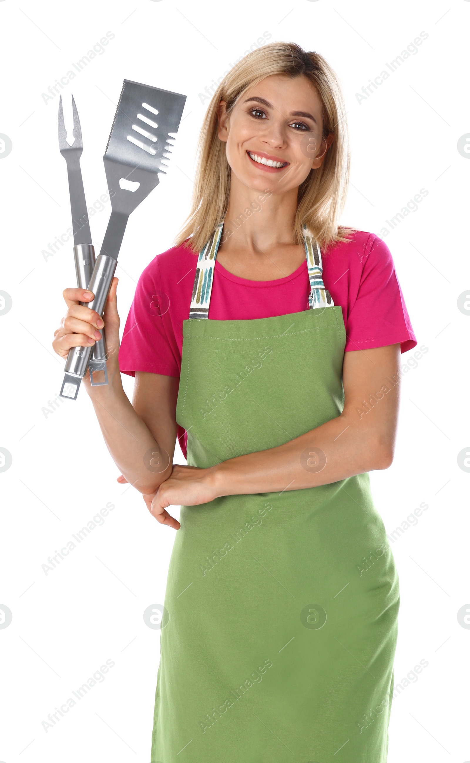 Photo of Woman in apron with barbecue utensils on white background