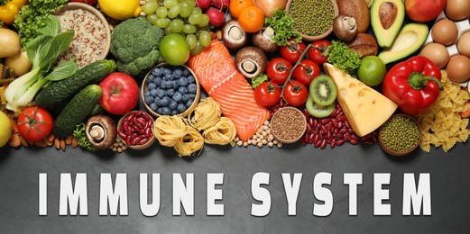 Image of Immune system boosting with proper nutrition. Different foods on black table, flat lay. Banner design