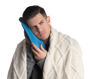 Man holding hot water bottle near face on white background