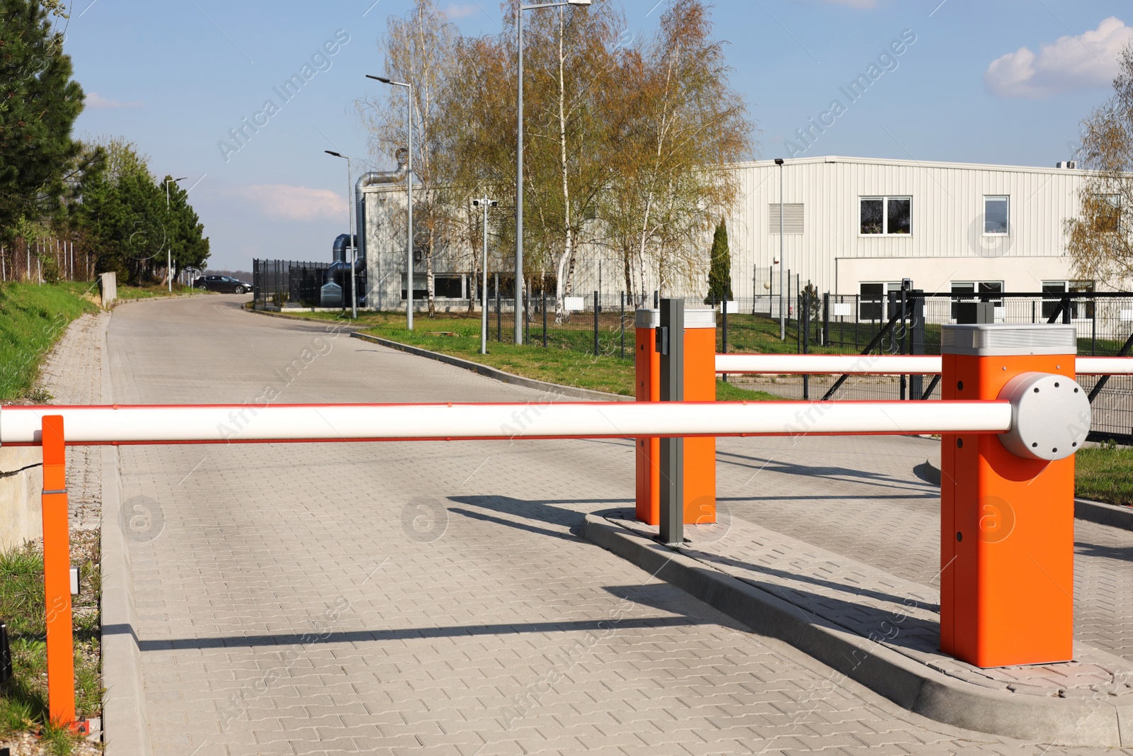 Photo of Orange road barriers outdoors on sunny day