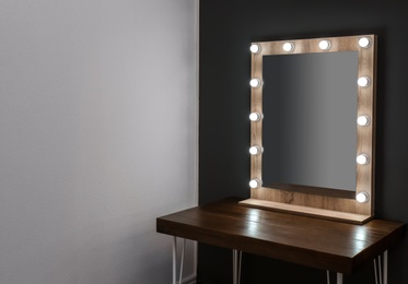 Photo of Beautiful mirror in modern makeup room