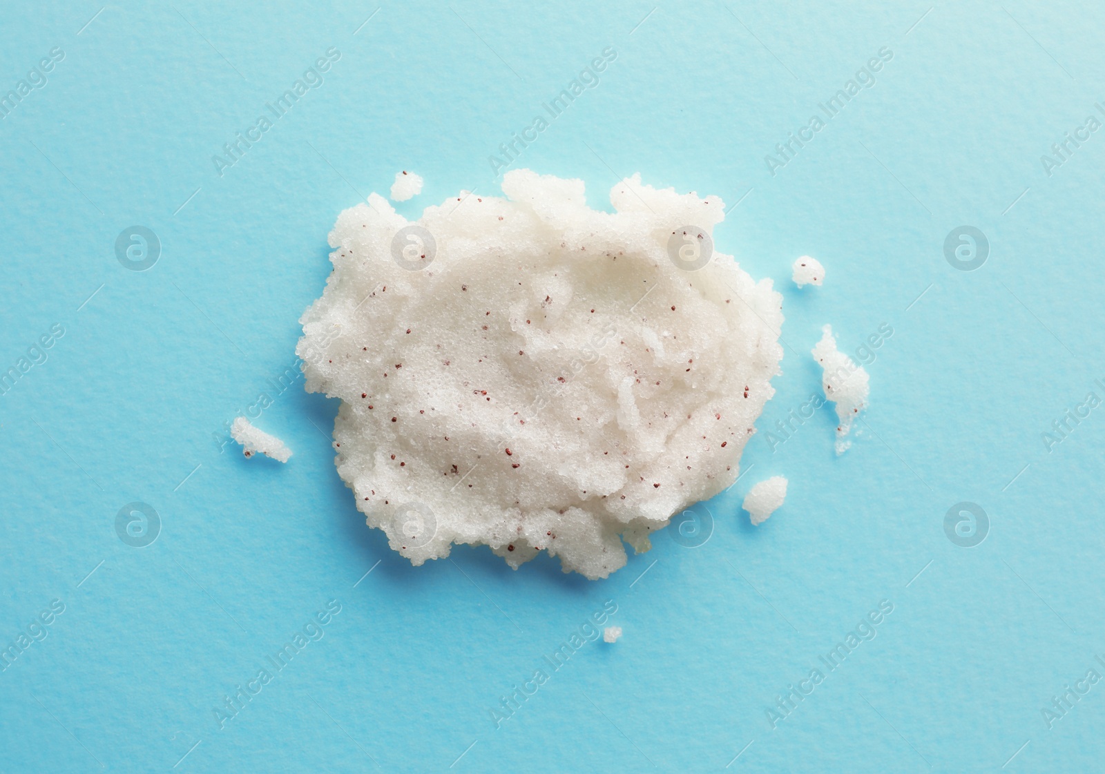 Photo of Sample of scrub on turquoise background, top view