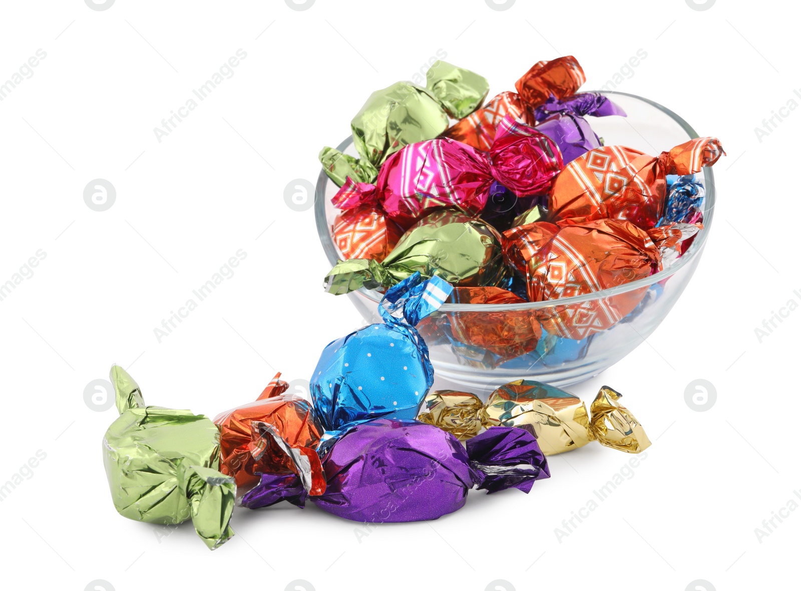 Photo of Bowl with sweet candies in colorful wrappers on white background