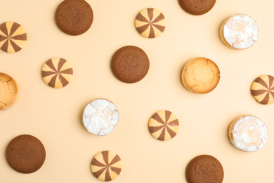 Photo of Delicious cookies on beige background, flat lay
