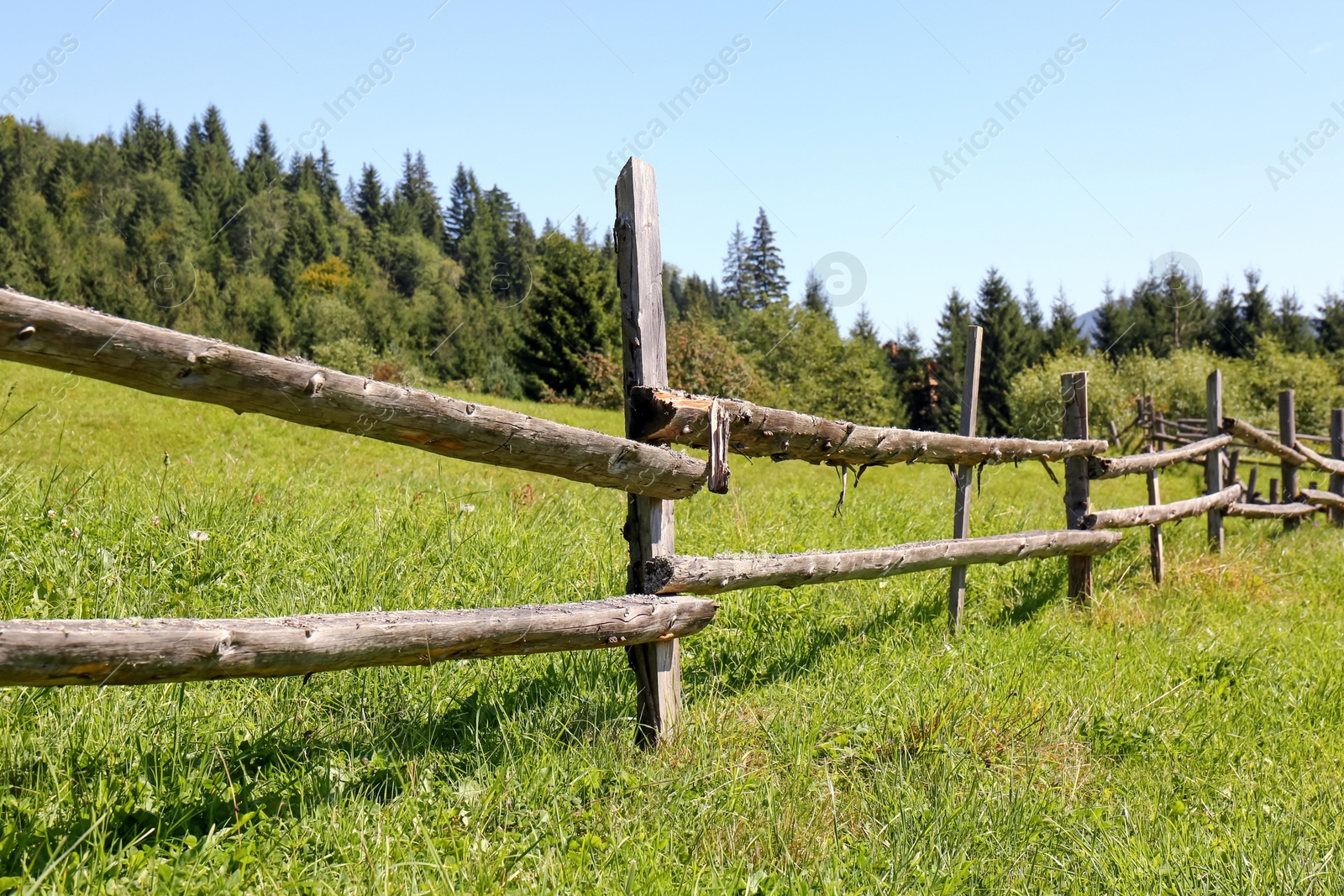 Photo of Beautiful view of mountain countryside with wooden fence