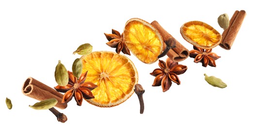 Image of Slices of dried orange, aromatic anise stars, cinnamon, cloves and cardamom falling on white background. Banner design