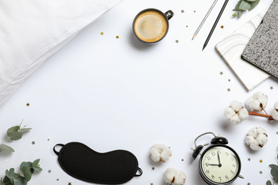 Photo of Composition with sleeping mask on white background, top view. Bedtime accessories