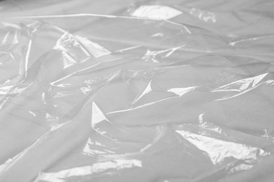 Photo of Closeup view of transparent plastic stretch wrap film as background