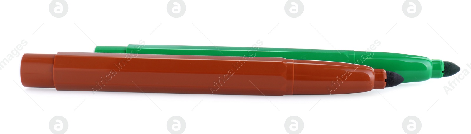 Photo of Brown and green markers on white background