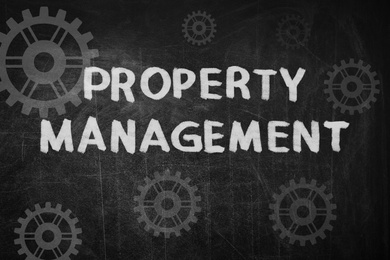 Image of Text Property Management and gear images on black chalkboard