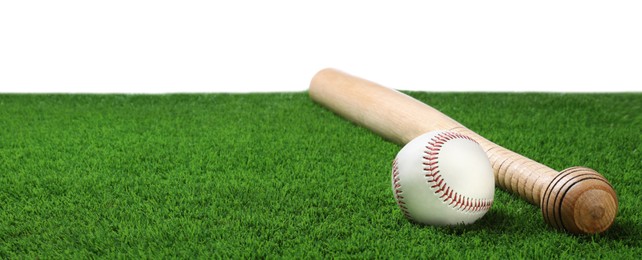 Photo of Baseball bat and ball on artificial grass against white background