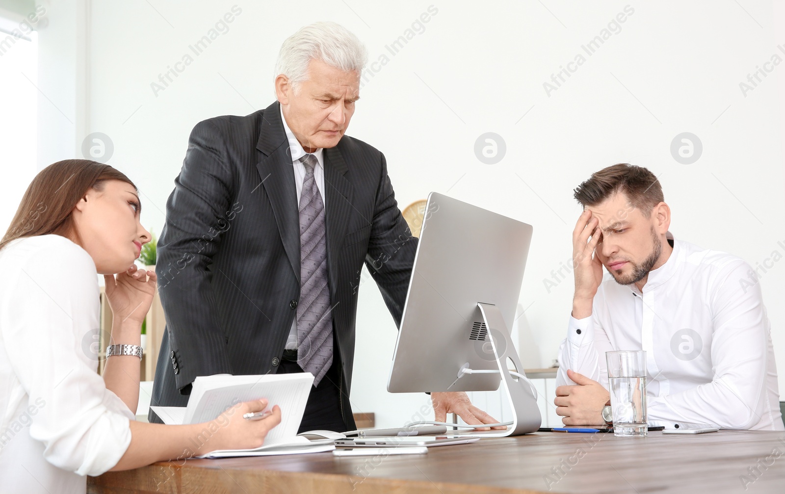 Photo of Office employees having argument at workplace