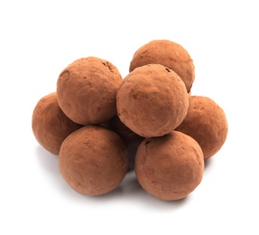 Delicious raw chocolate truffles on white background