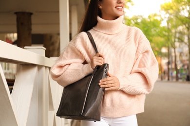 Photo of Woman with stylish shopper bag outdoors, closeup